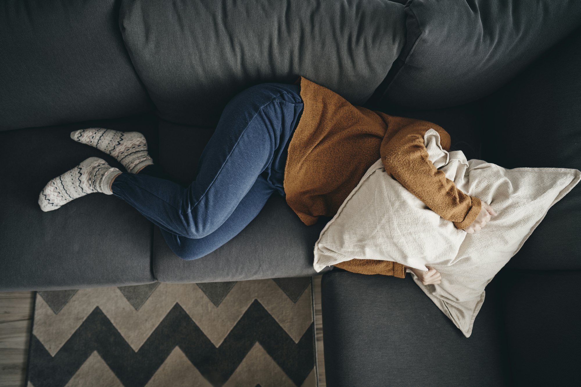 Woman with emotional problems lying on the couch